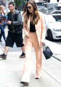 Elizabeth Olsen steps out in a pink pantsuit while stopping by an office building in New York City