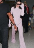 Kendall Jenner touches down at LAX airport wearing an all purple outfit, Los Angeles