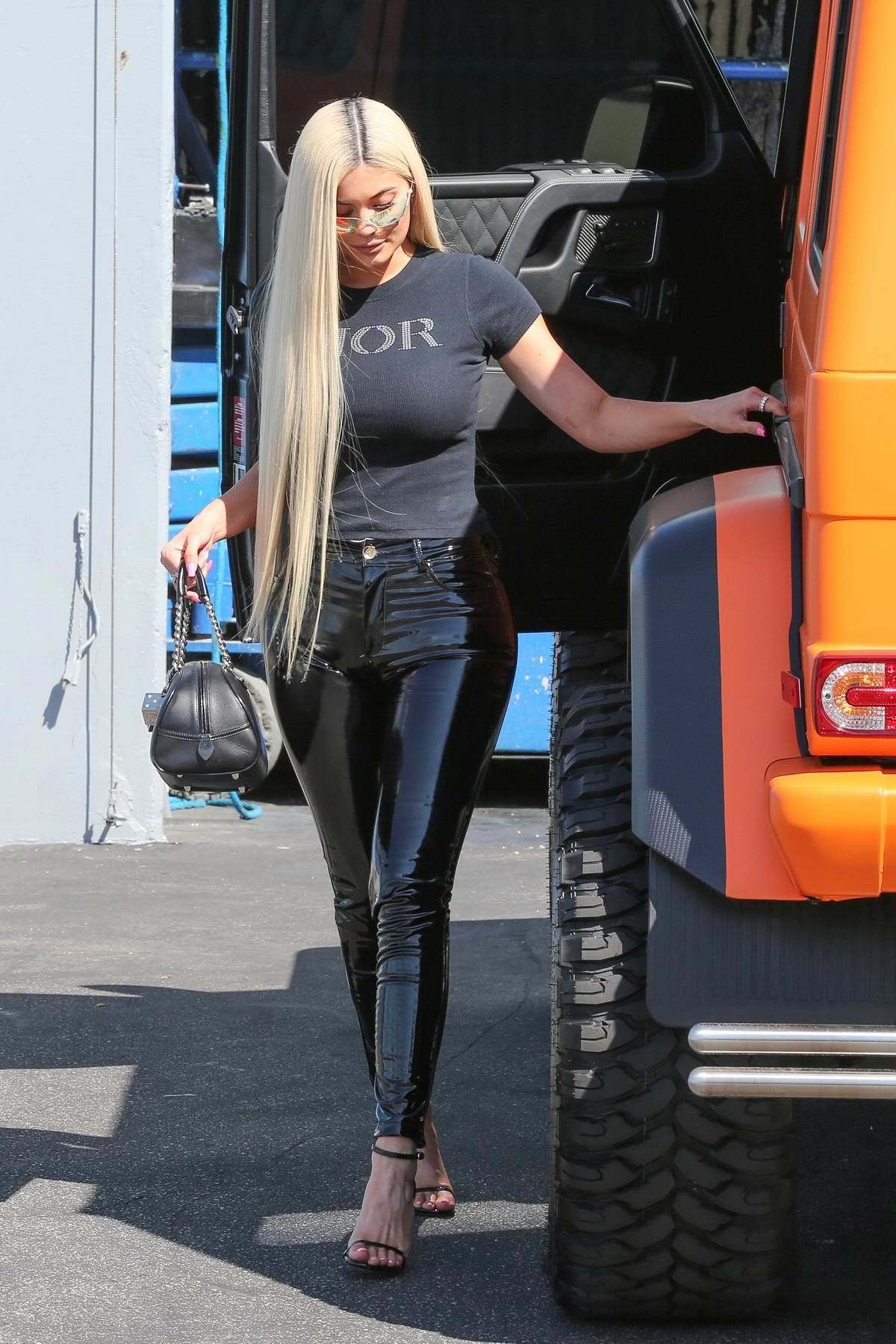 kylie jenner rocks a dior tee with black latex tights as she leaves a  studio in woodland hills, california-080918_6