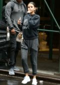 Selena Gomez wears a grey Versace sweatshirt with matching sweatpants as she steps out to grab some iced coffee in New York City