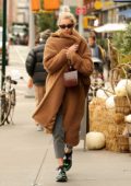 Elsa Hosk looks warm and cozy in a brown sherpa coat while out in New York City