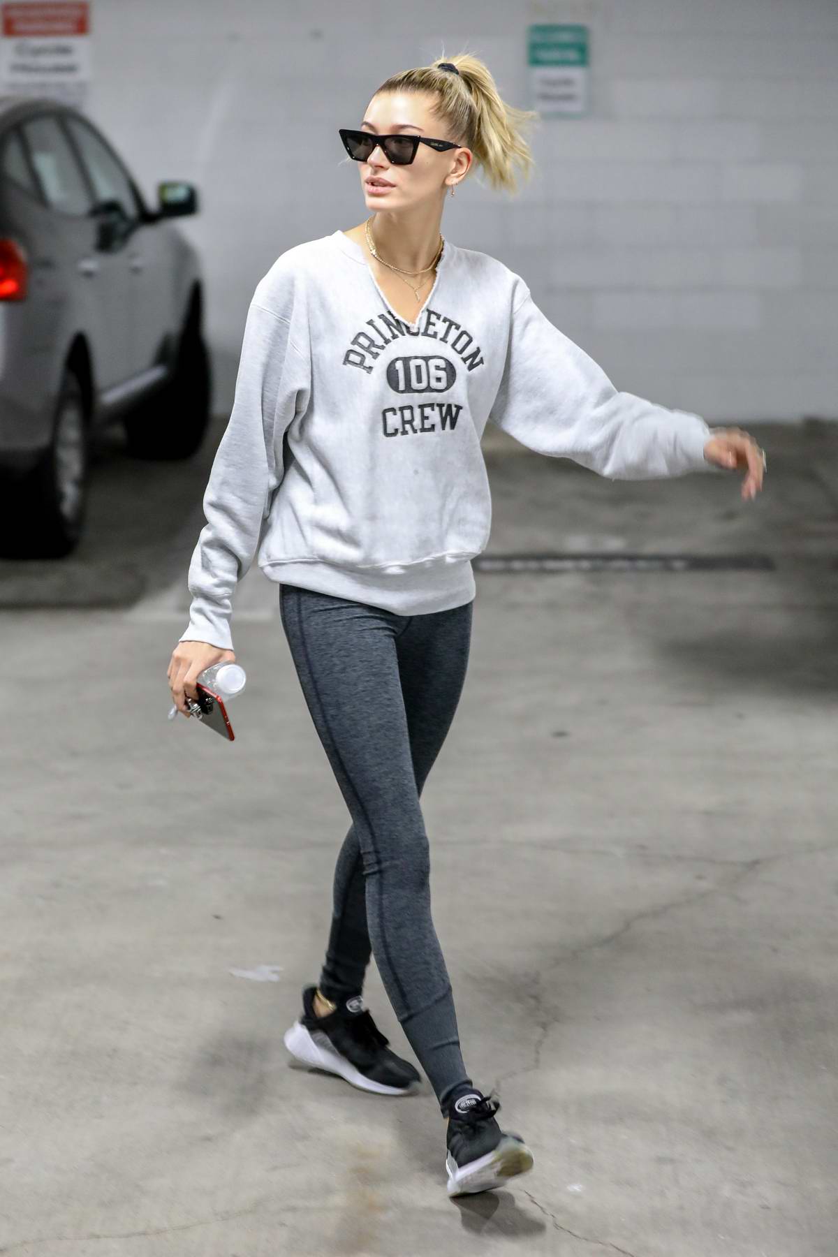 Hailey Bieber flaunts her street style in leggings and crewneck sweater