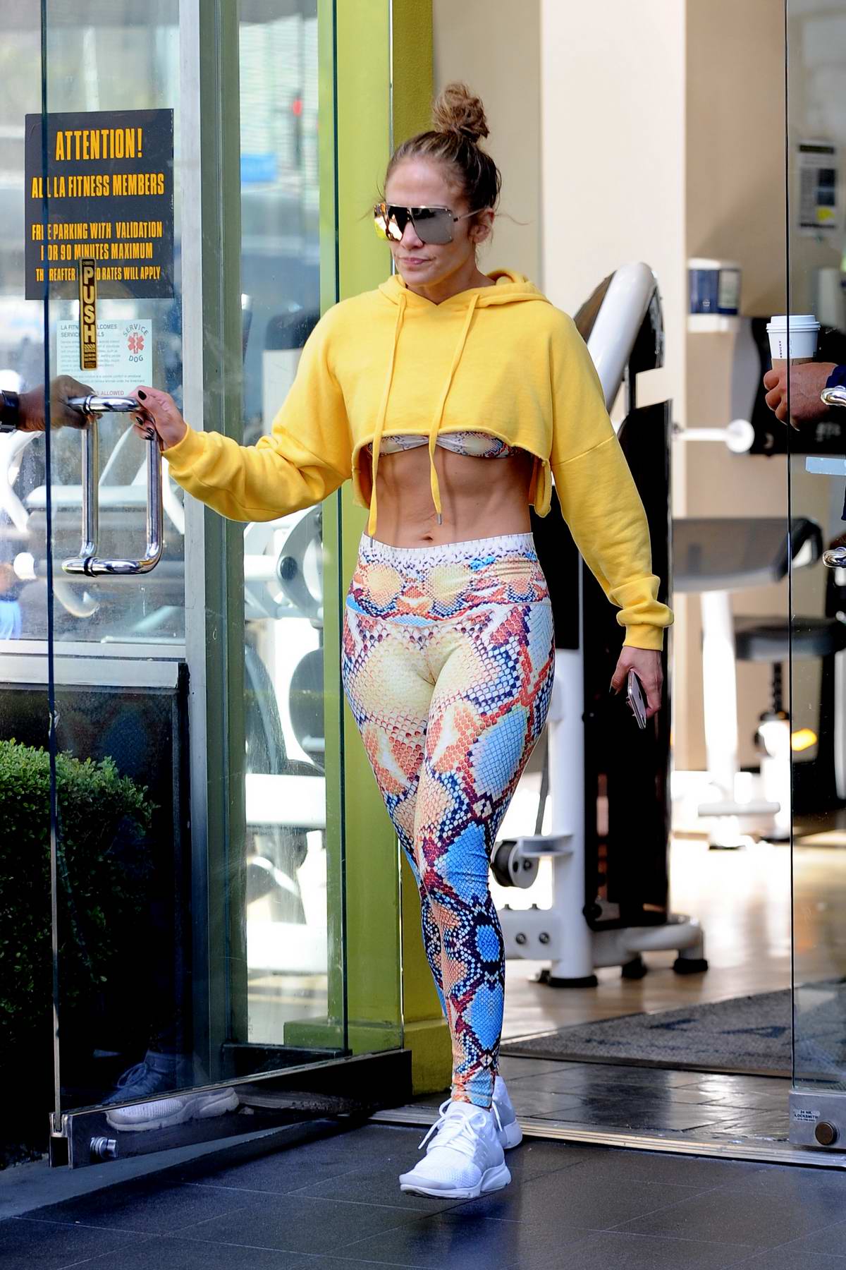 jennifer lopez rocks snakeskin print gym wear with a yellow hoodie while heading to the gym later seen at noahs bagels in westwood los angeles 261018 9