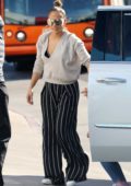 Jennifer Lopez wears a deep neck sweater with a striped jumpsuit as she steps out with her daughter for some shopping in West Hollywood, Los Angeles