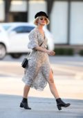 Julianne Hough looks lovely in a patterned white dress paired with ankle high boots and a black hat while out in Los Angeles