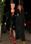 Katy Perry rocks a black leather coat and orange ankle boots as she leaves Giorgio Baldi Italian restaurant during a night out in Santa Monica, California