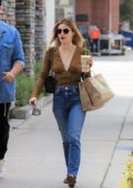 Lucy Hale wears a plunging brown top and jeans as she picks up breakfast at Kreation in Los Angeles