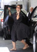 Minka Kelly is all smiles as she steps out in a black polka dot dress in Beverly Hills, Los Angeles