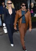 Sophie Turner seen wearing a blue pinstriped suit as she and Joe Jonas leaves L`Avenue restaurant in Paris, France