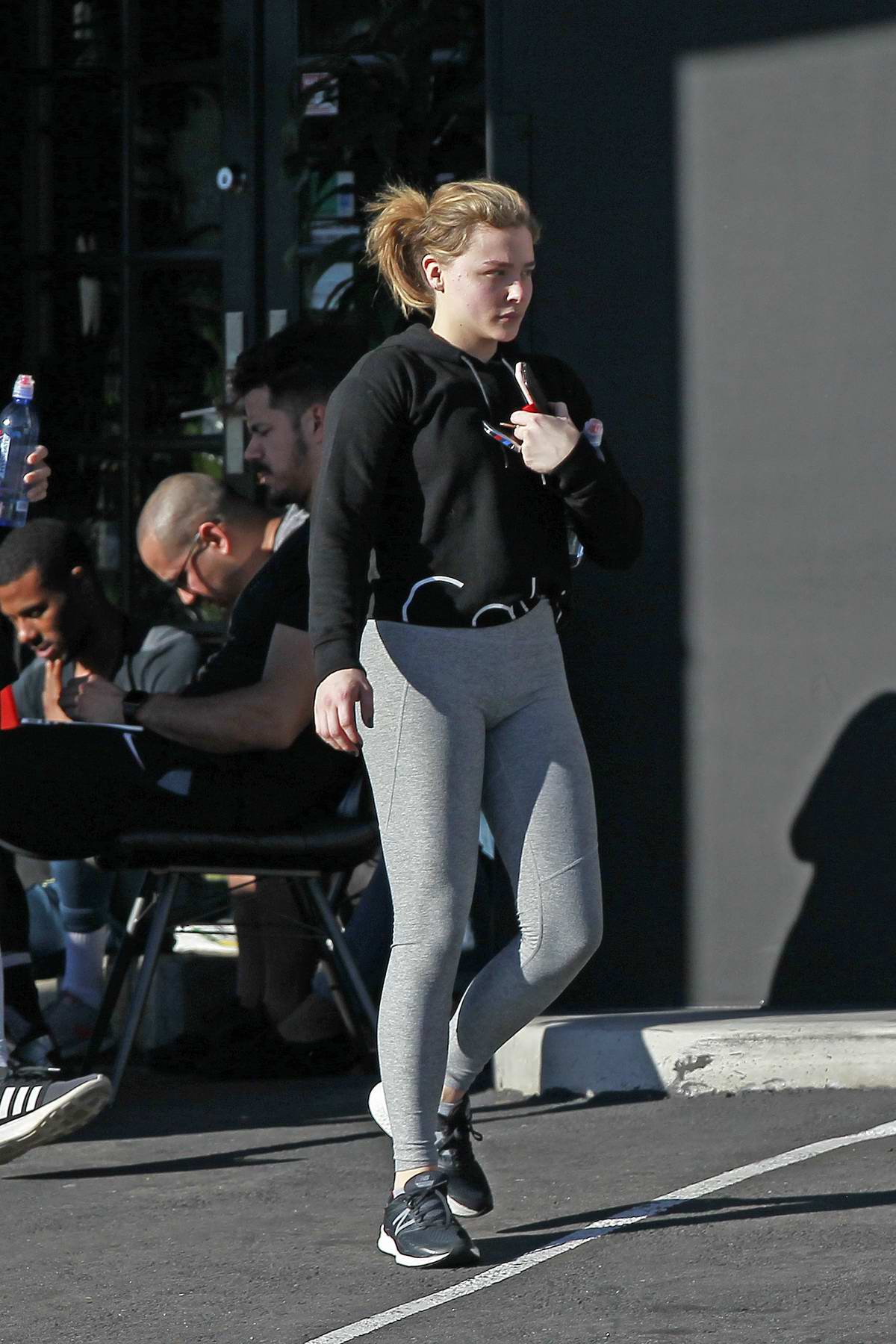https://www.celebsfirst.com/wp-content/uploads/2018/11/chloe-grace-moretz-wears-a-calvin-klein-hoodie-and-grey-leggings-as-she-leaves-the-gym-in-los-angeles-261118_7.jpg