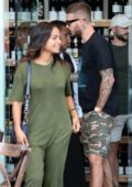 Christina Milian seen wearing a green jumpsuit while out with boyfriend Matt Pokora to pick up some wine in Los Angeles