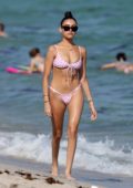 Madison Beer shows off her beach body in a pink and white animal print bikini on Miami Beach, Florida