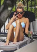 Olivia Attwood and Megan McKenna lounges by the poolside in their bikinis while hanging out at the hotel in Australia