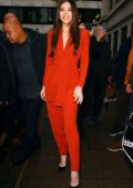 Hailee Steinfeld wears an orange jumpsuit while out promoting her upcoming movie Bumblebee in London, UK