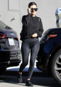 Kourtney Kardashian sports a black sweatshirt, leggings and matching Nike trainers while out to lunch in West Hollywood, Los Angeles