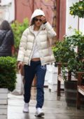 Alessandra Ambrosio braves the rain with a white puffer jacket while out for some shopping in Los Angeles