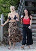 Caroline Vreeland and Jasmine Waltz slip into their bikinis while enjoying beach day with friends on Miami Beach, Florida