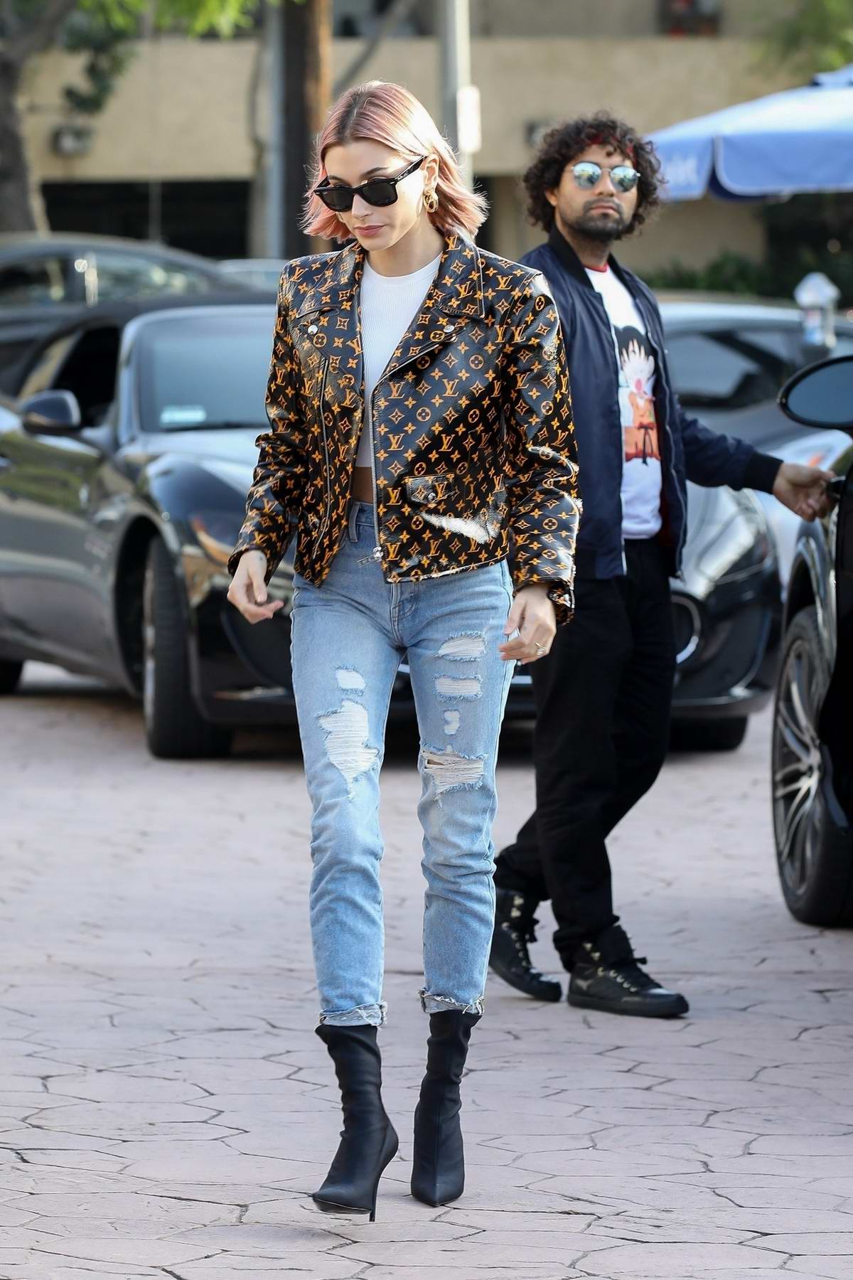 Hailey Baldwin Bieber looks trendy in a Louis Vuitton jacket while