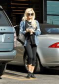 Holly Madison wears a graphic black tee, black leggings with a denim jacket while stopping by Gelson's in Los Feliz, California