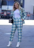 Iskra Lawrence seen wearing a plaid suit and white boots while out in Los Angeles