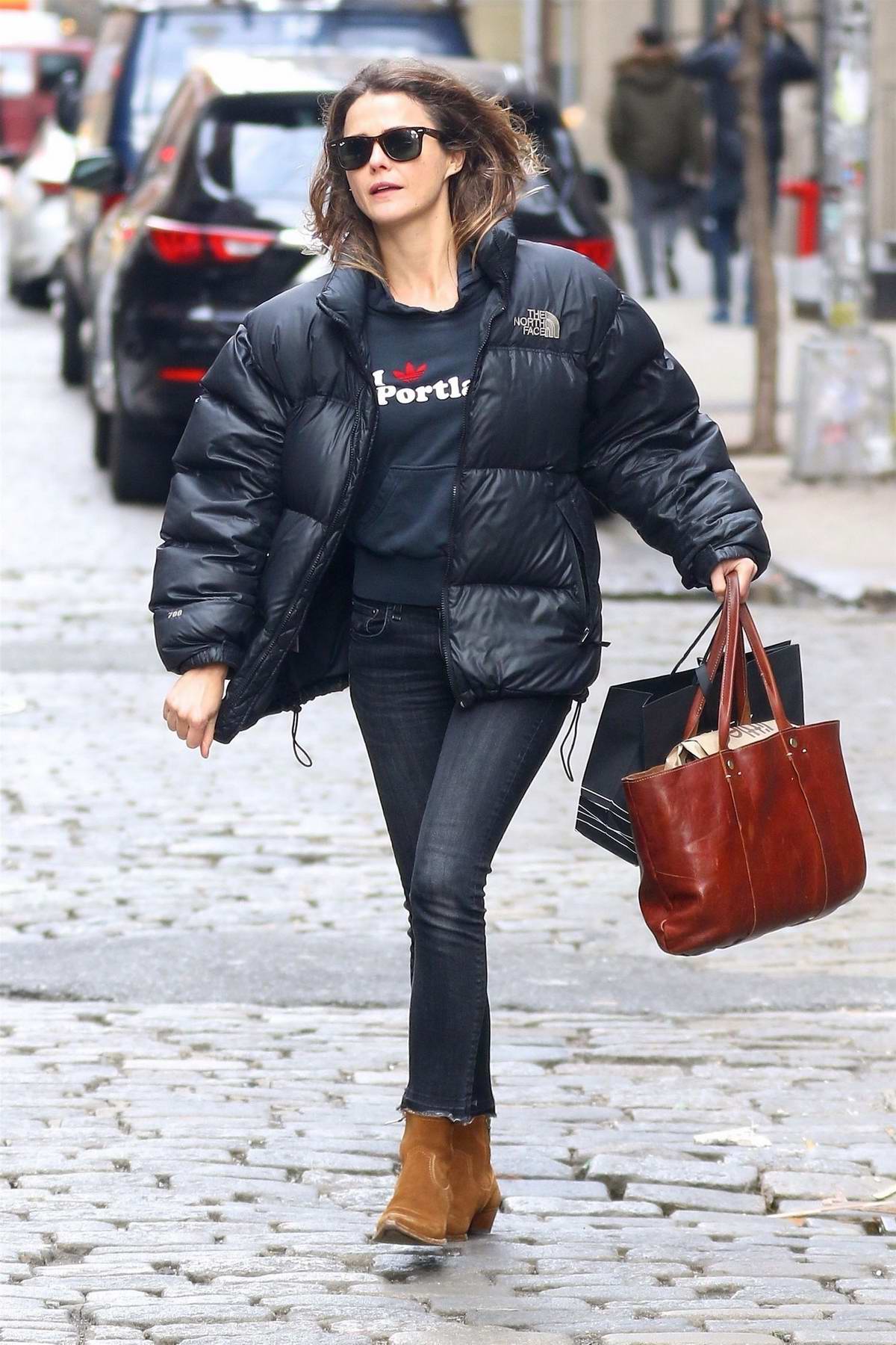 keri russell wore a black puffer jacket while out shopping for