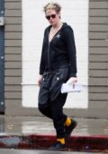 Kristen Stewart steps out in the rain to visit a hair salon in Los Angeles