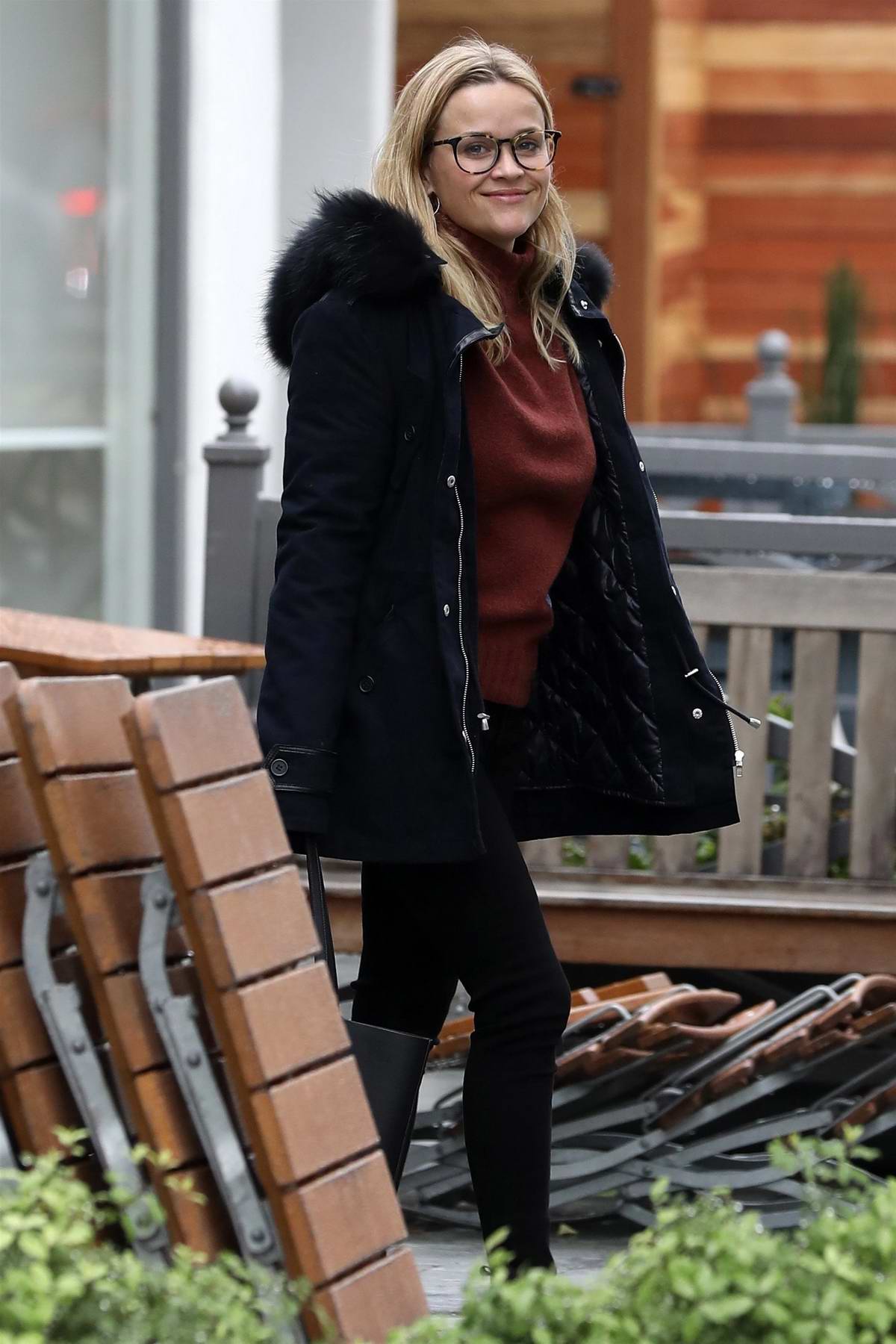 Kate Mara seen wearing a fur-lined denim jacket and black leggings