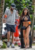 Demi Rose stuns in a black bikini while out to lunch with boyfriend Chris Martinez in Tulum, Mexico