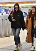 Dua Lipa spotted in a black hoodie and jeans as she arrives at LAX airport in Los Angeles