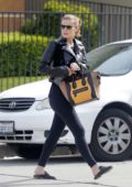 Kate Mara hides her baby bump behind a Céline Tote while out running errands in Beverly Hills, Los Angeles