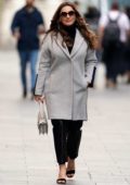 Kelly Brook steps out in a grey blazer and black leather pants while heading to the Global Radio studios in London, UK