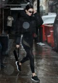 Kendall Jenner steps out under the rain in all black athleisure ensemble in New York City