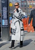 Rosie Huntington Whiteley wears a stylish Celine coat with black knee high boots while out in New York City