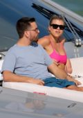 Sofia Richie wears a hot pink bikini top while relaxing on a yacht with Scott Disick in Miami, Florida