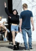 Ariel Winter wears a cropped black sweater and denim shorts while out for lunch with Levi Meaden at Joan's on Third in Studio City, Los Angeles