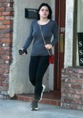 Ariel Winter wears a grey long sleeve shirt and black leggings as she leaves her yoga class in Los Angeles