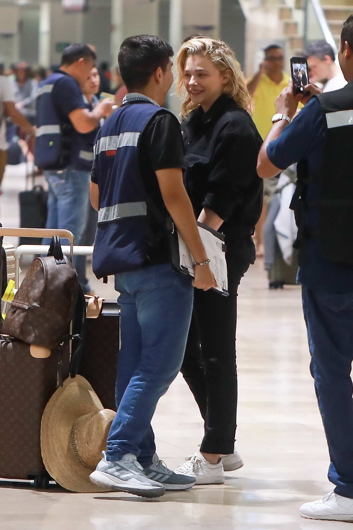 Chloe Grace Moretz and girlfriend Kate Harrison fly out of Mexico