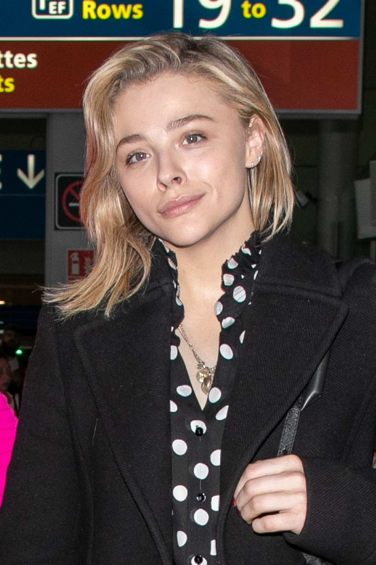 chloe grace moretz spotted in all black with her louis vuitton bags as she arrives at the cdg ...