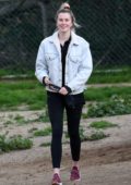 Ireland Baldwin gets playful with her dogs at a Hollywood Hills dog park in Los Angeles