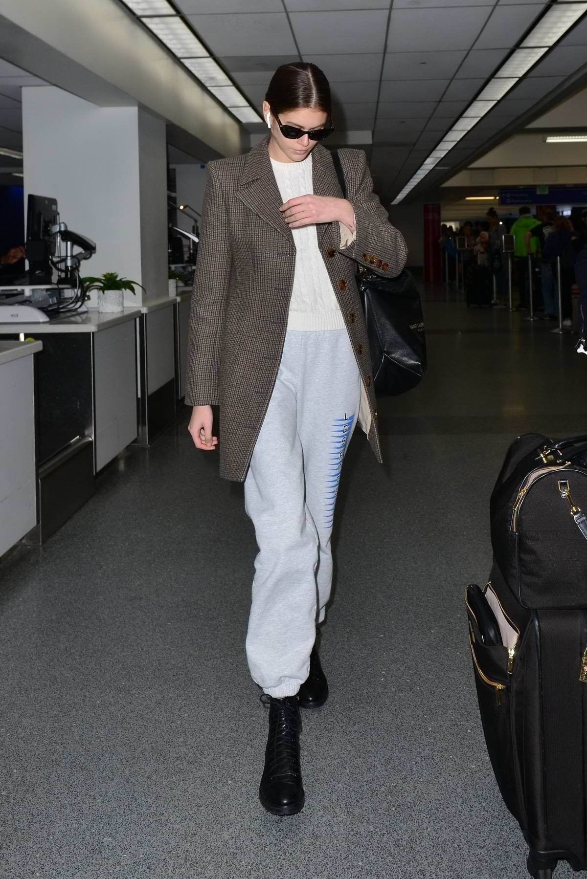 Lily-Rose Depp rocks newspaper print leggings and denim jacket as