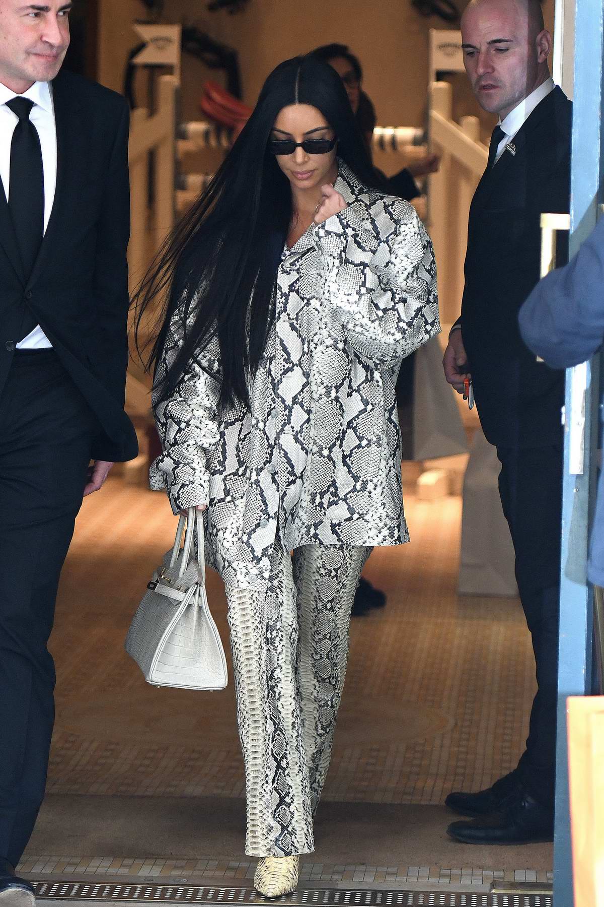 kim kardashian seen wearing snakeskin print ensemble as she leaves hermes  store in paris, france-250319_2