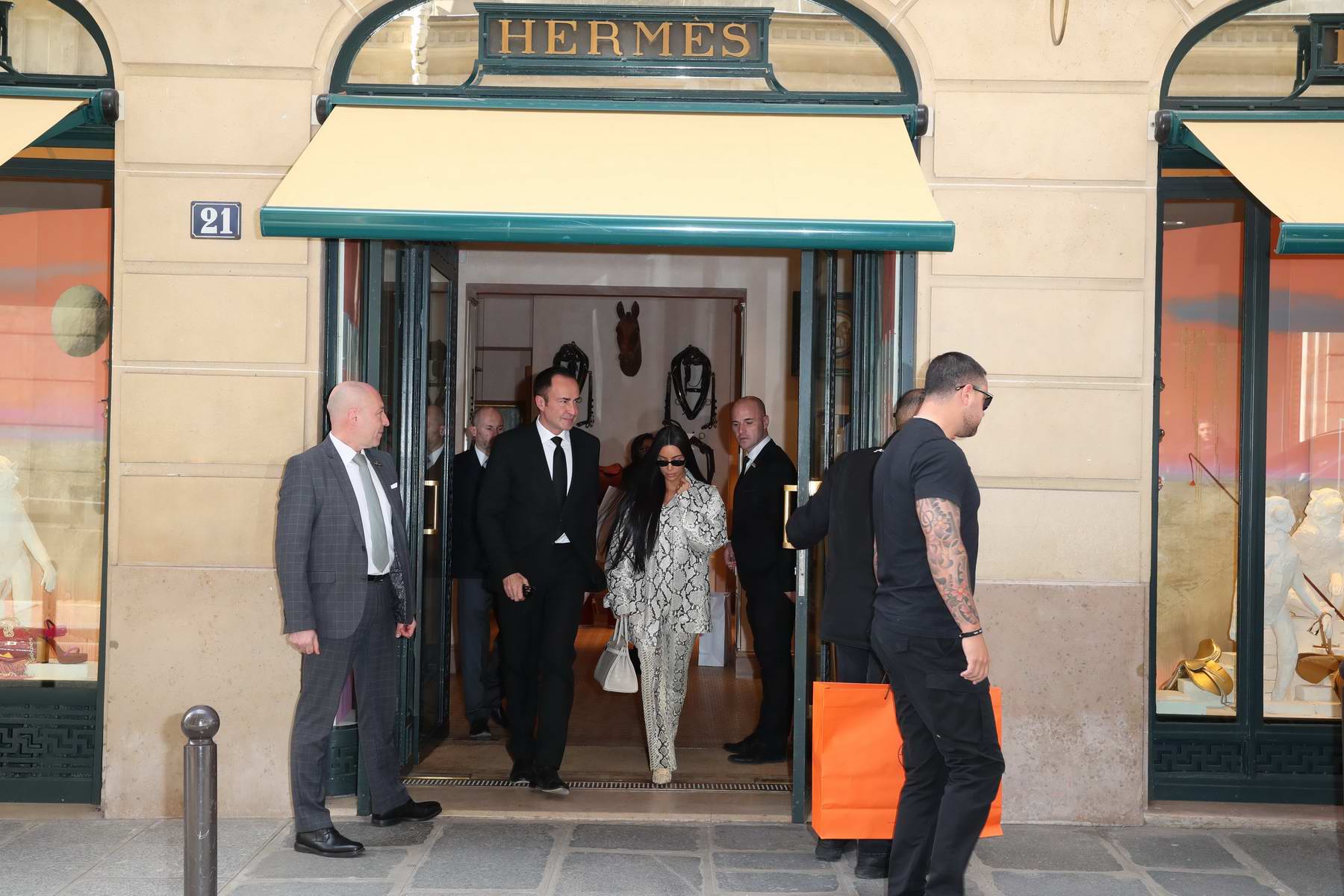 kim kardashian seen wearing snakeskin print ensemble as she leaves hermes  store in paris, france-250319_9