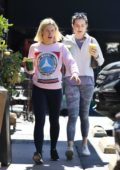 Kristen Bell wore a pink sweatshirt and leggings while out to pick up a green smoothie with a friend at Lassen's in Los Feliz, California