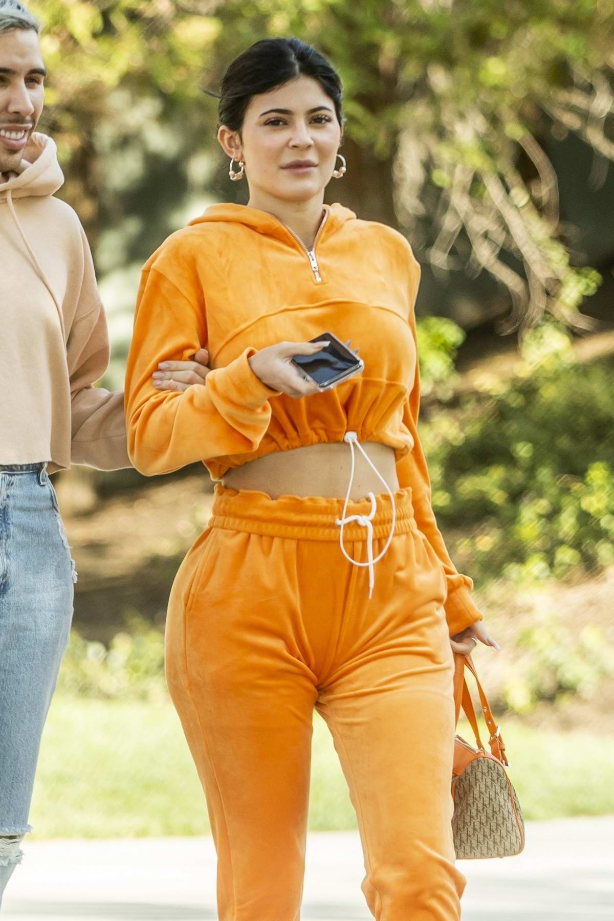 kylie jenner stands out in bright orange while out for lunch with a ...