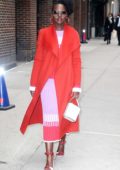 Lupita Nyong'o stands out in a bright red coat while visiting 'The Late Show with Stephen Colbert' in New York City