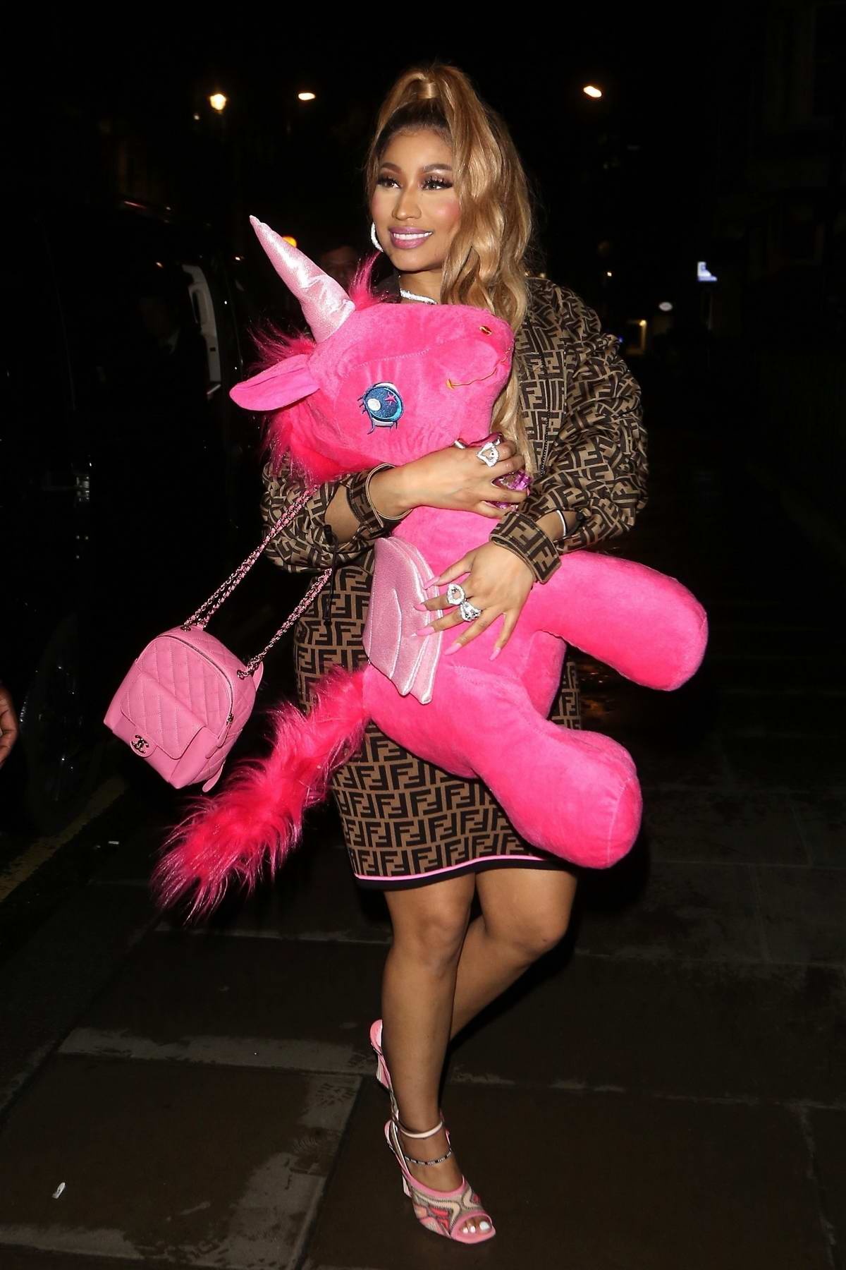 Nicki Minaj rocks a Fendi dress and a pink unicorn as she leaves Opium  nightclub in