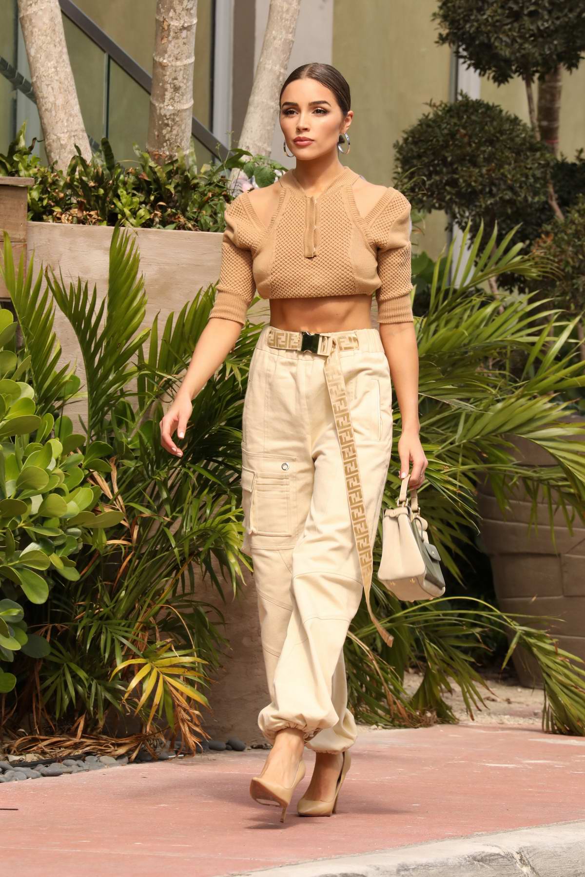 Olivia Culpo looks super stylish in a brown crop top, beige cargo pants ...