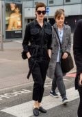 Anne Hathaway seen wearing black denim jumpsuit as she touches down at Heathrow Airport in London, UK