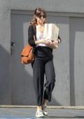 Dakota Johnson seen leaving book soup with a bagful of books in West Hollywood, Los Angeles