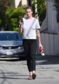 Ireland Baldwin keeps it casual with a white tee, black jeans and sandals as she leaves the hair salon in Los Angeles